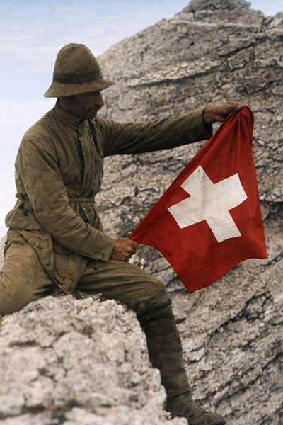Early Mountaineer with Swiss Flag on Mount Olympus Summit